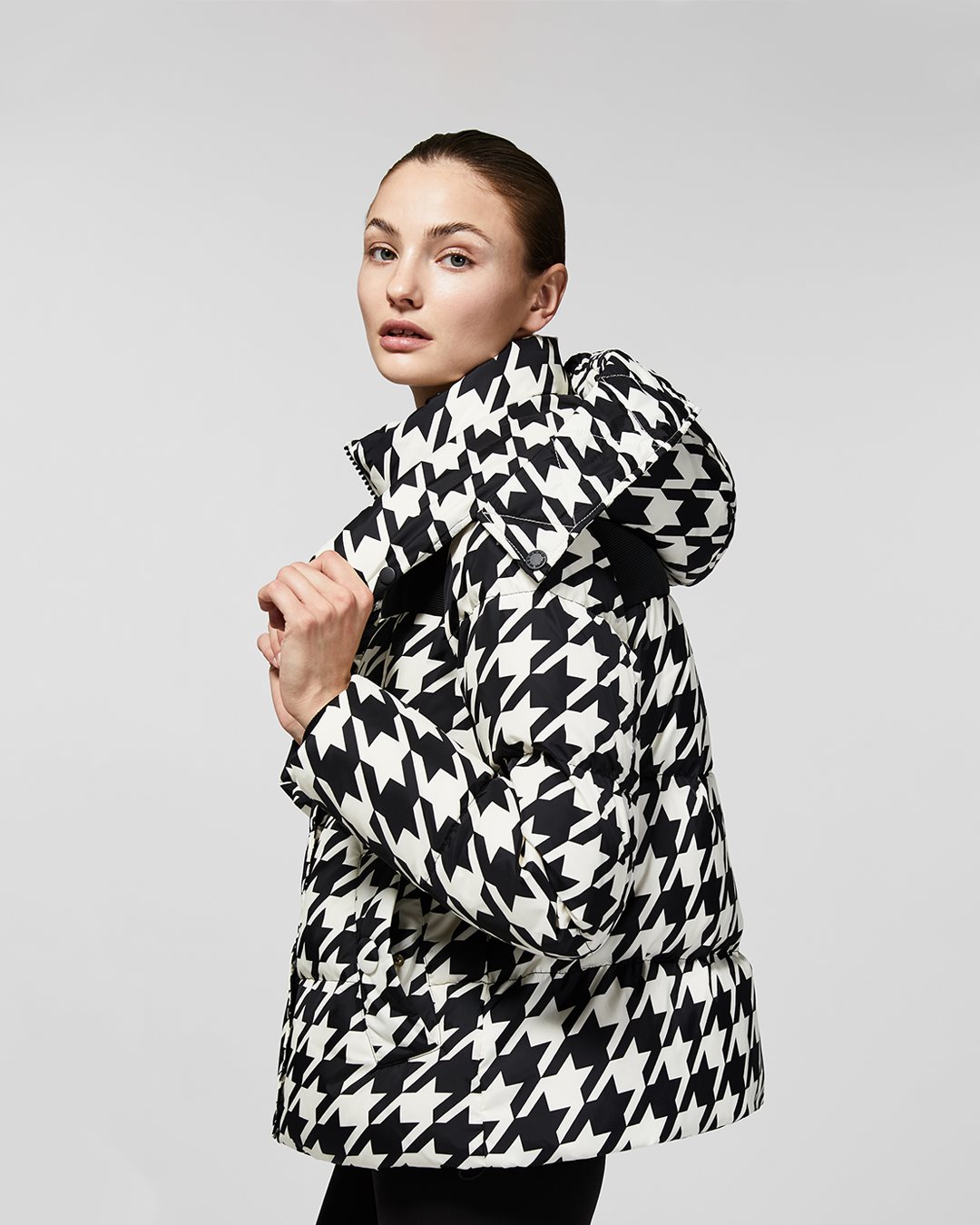 The magic of iconic 60s style is unveiled in a dazzling display pf houndstooth prints and cool colour-blocking to master sub-zero dressing.