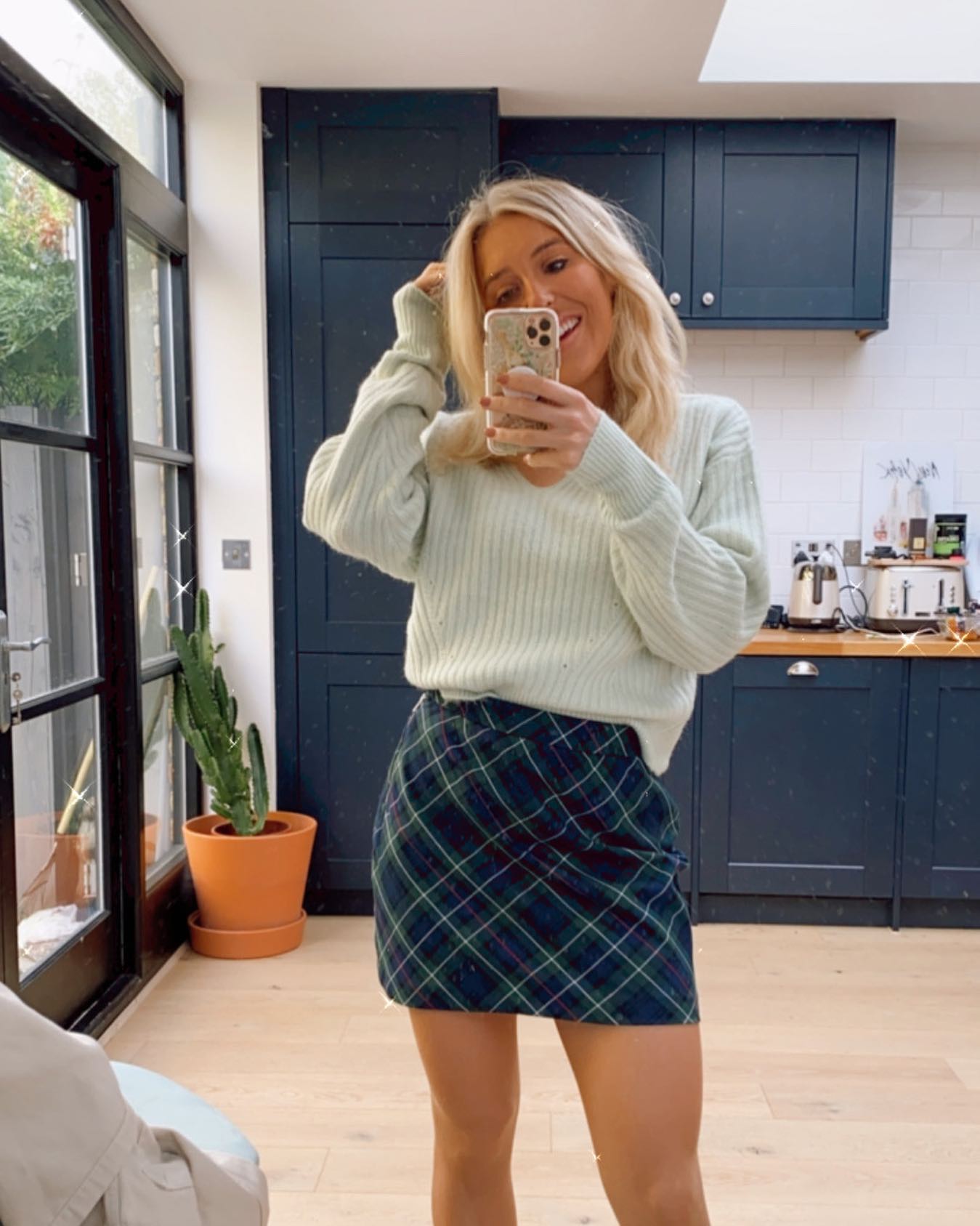 Dressing up to stay home @emshelx keeping it comfy but cute in our Derby Check Skirt 🖤