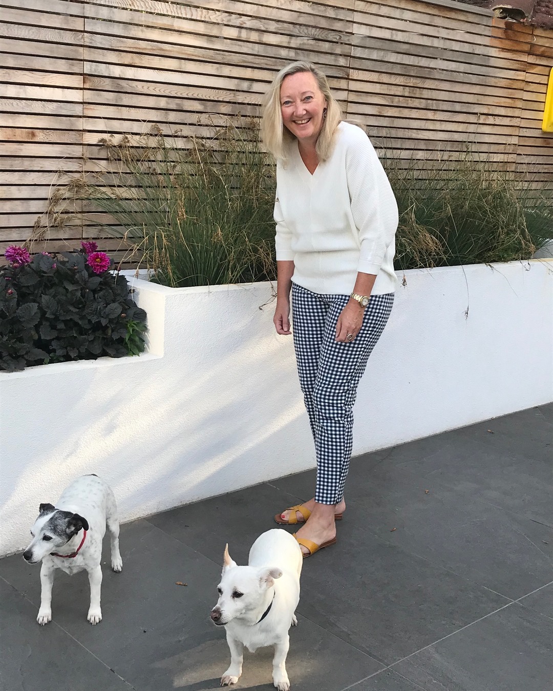 Assistant, Veronica wears our Rylie Jumper and Tyna Gingham Trousers, “This monochrome look is perfect now there’s a chill in the air and I love how it takes minimal styling to make an impact. My dogs, Daisy and Hattie approve too!" ⠀⠀⠀⠀⠀⠀⠀⠀⠀