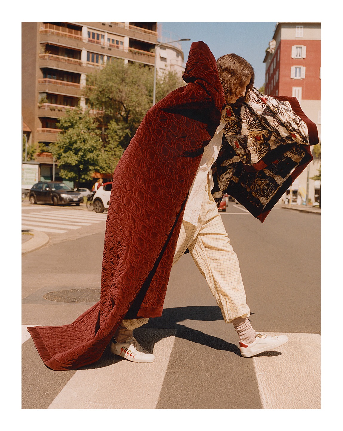 Featured in the June issue of ICON Spain, a Gucci Décor silk and velvet quilt, wool pants and cotton socks from Gucci Pre-Fall 2019 and the Gucci Ace sneakers designed by Alessandro Michele.  Photographer: Paolo Zerbini 
