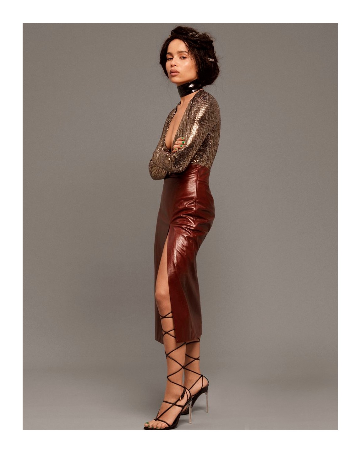 Zoë Kravitz appears in the February issue of Elle USA wearing a deep-v neck long sleeve top and leather skirt with side slit from Gucci Spring Summer 2020 by Alessandro Michele. 