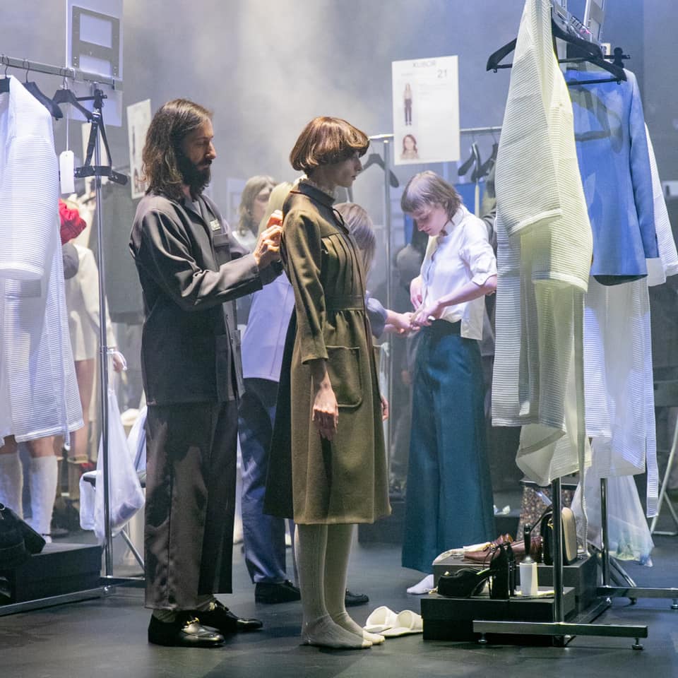 ‘Façonnier de Rêves’ (Maker of Dreams) is embroidered on the uniforms of the Gucci creative team who dressed 60 models inside a glass walled cylinder 