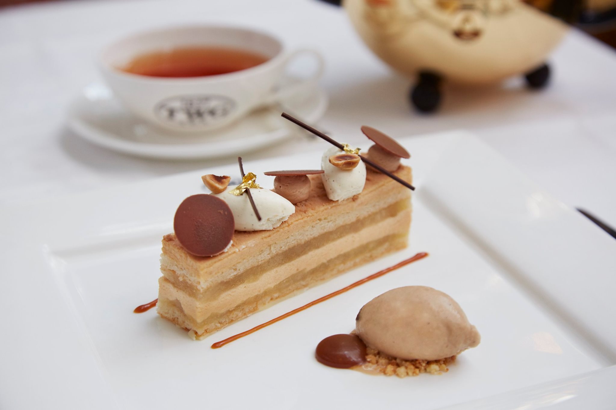 Apple caramel mousse cake with roasted hazelnuts topped with Jivara chocolate mousse and vanilla Chantilly cream served with caramel sauce and a scoop of Napoleon Tea ice cream on this week's set menu. Available at all TWG Tea Salons in Singapore.