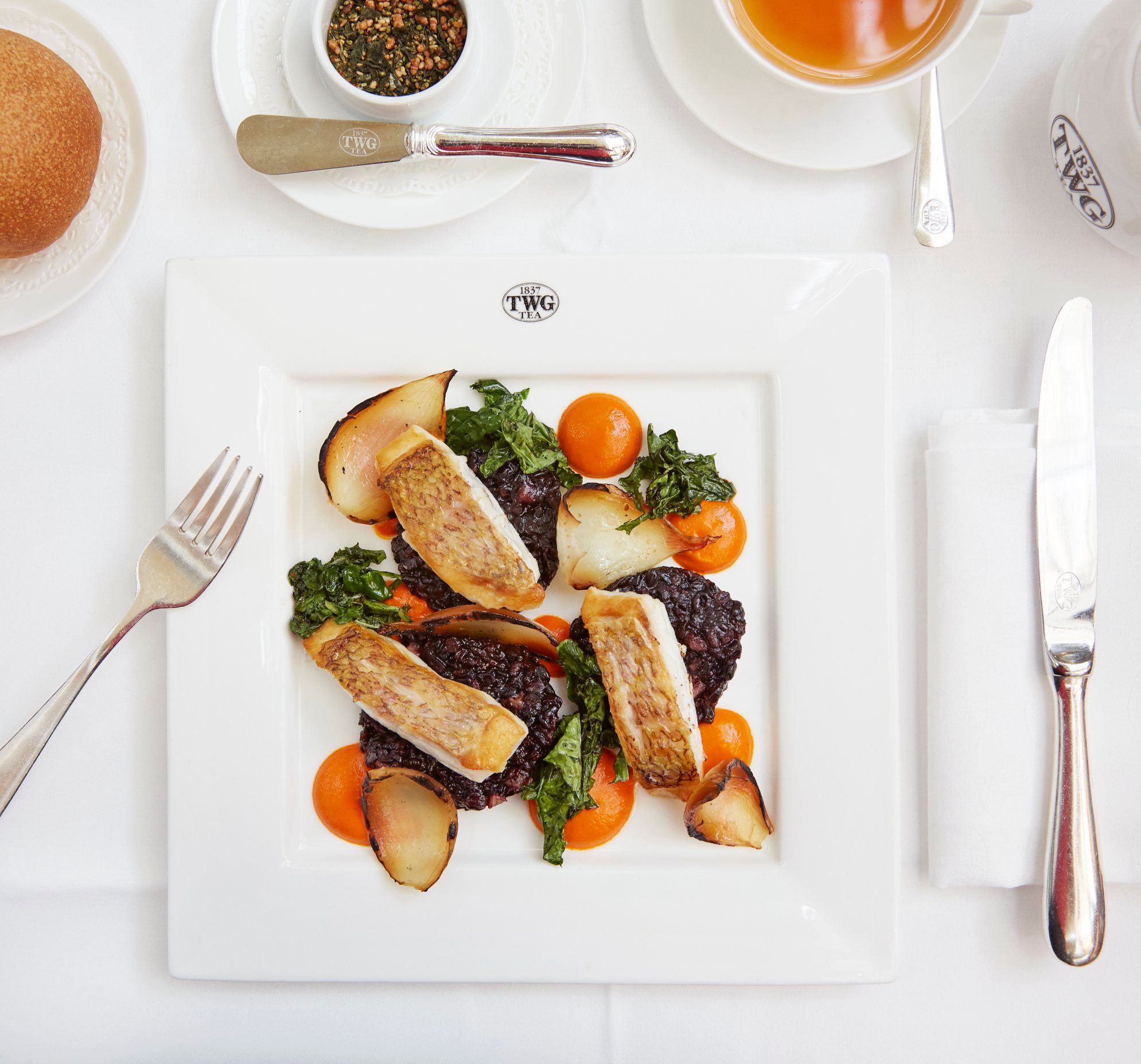 Pan-seared Atlantic sea bream served with Smoky Earl Grey infused sweet and sour capsicum coulis, accompanied by veal bacon, Korean black glutinous rice, kale and charred onions.