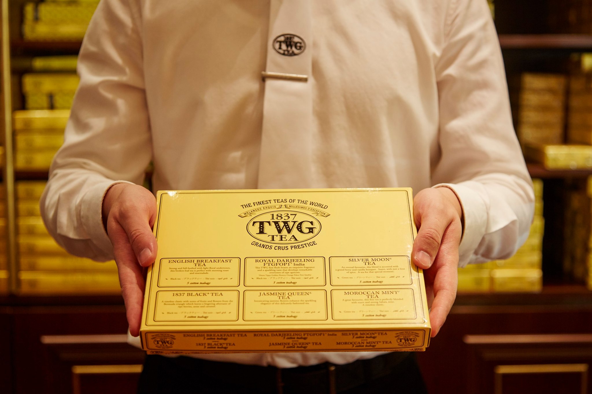 TWG Tea presents the ultimate teabag, entirely hand-sewn from 100% cotton containing 2½ grams of whole-leaf fine harvests and exclusive tea blends. This classic teabag assortment includes English Breakfast Tea, 1837 Black Tea, Royal Darjeeling FTGFOP1, Silver Moon Tea, Jasmine Queen Tea and Moroccan Mint Tea, displayed in a magnificent gift box. Shop now at TWGTea.Com.