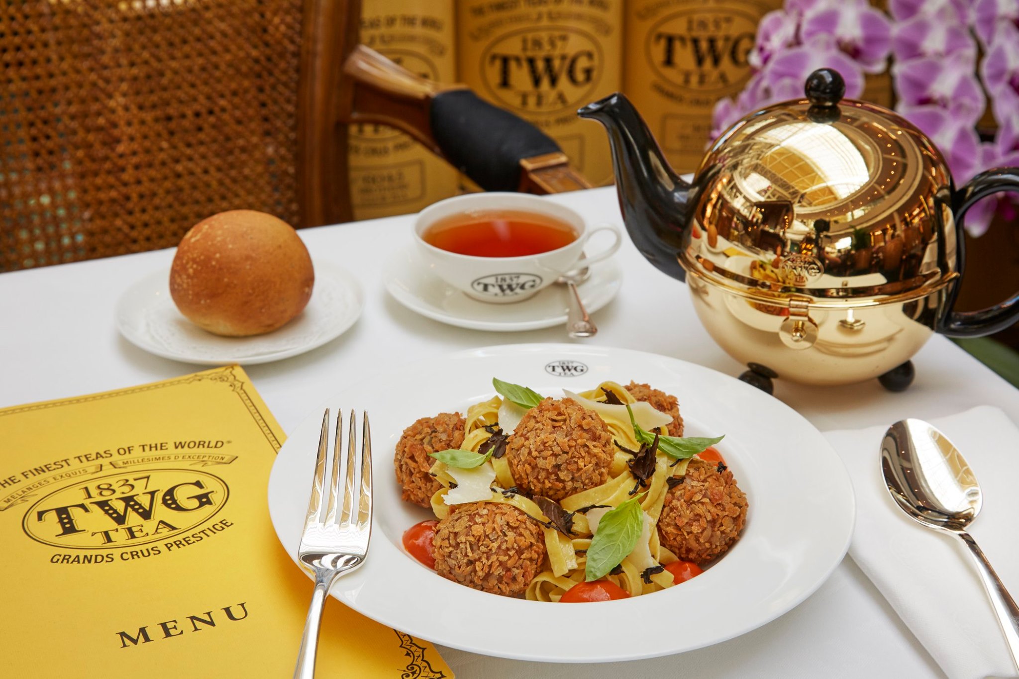 Crispy Sicilian style Wagyu meatballs in a tomato sauce accompanied by Imperial Lapsang Souchong infused tagliatelle, served with parmesan cheese and fresh basil.