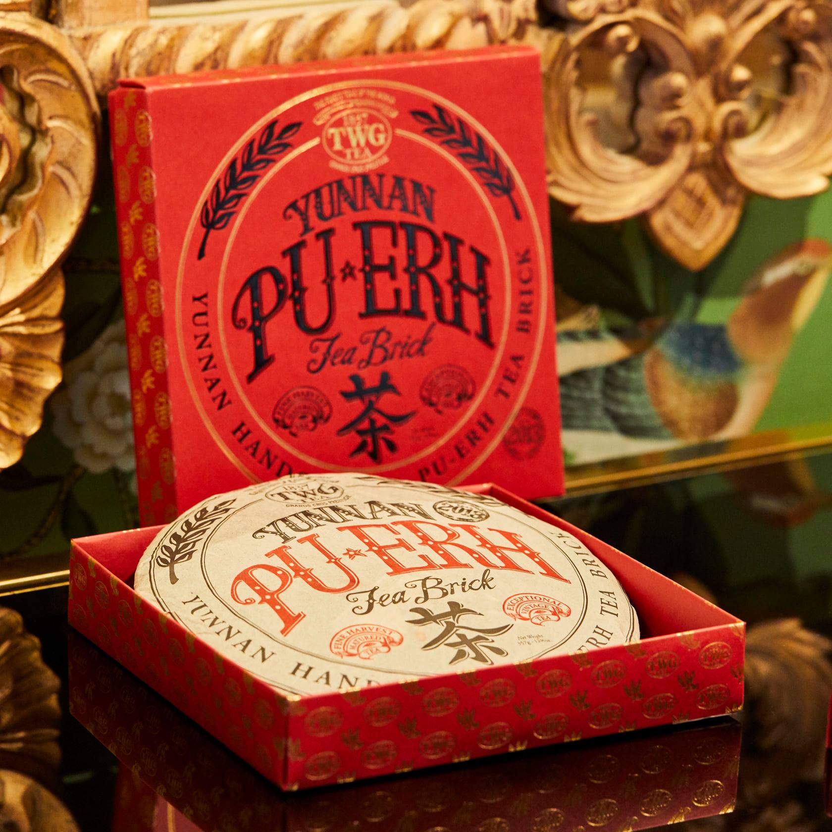 Tea appreciators will love this handmade Yunnan Pu-Erh Tea Brick, cultivated to order for TWG Tea in a traditional manner by the famed Meng Hai tea garden of Yunnan. Renowned for its refreshing and tonic attributes, this Pu-Erh has the unique particularity of improving with age. Packaged in a luxurious matte red and gold gift box adorned with a silk ribbon, this ancient tea craft is a perfect gift for the Lunar New Year season. Shop now at TWGTea.Com! #TWGTeaOfficial