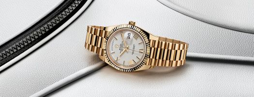 The Day-Date 40 in 18ct yellow gold featuring a white lacquer dial with faceted Roman numerals, and fitted with the President bracelet. #Rolex #DayDate #Perpetual
