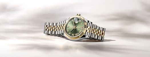 The Oyster Perpetual Datejust 31 in a yellow Rolesor version, combining Oystersteel and 18ct yellow gold, pairs an olive green dial with 18ct yellow gold Roman numerals – the VI set with 11 diamonds. #Rolex #Datejust #Perpetual
