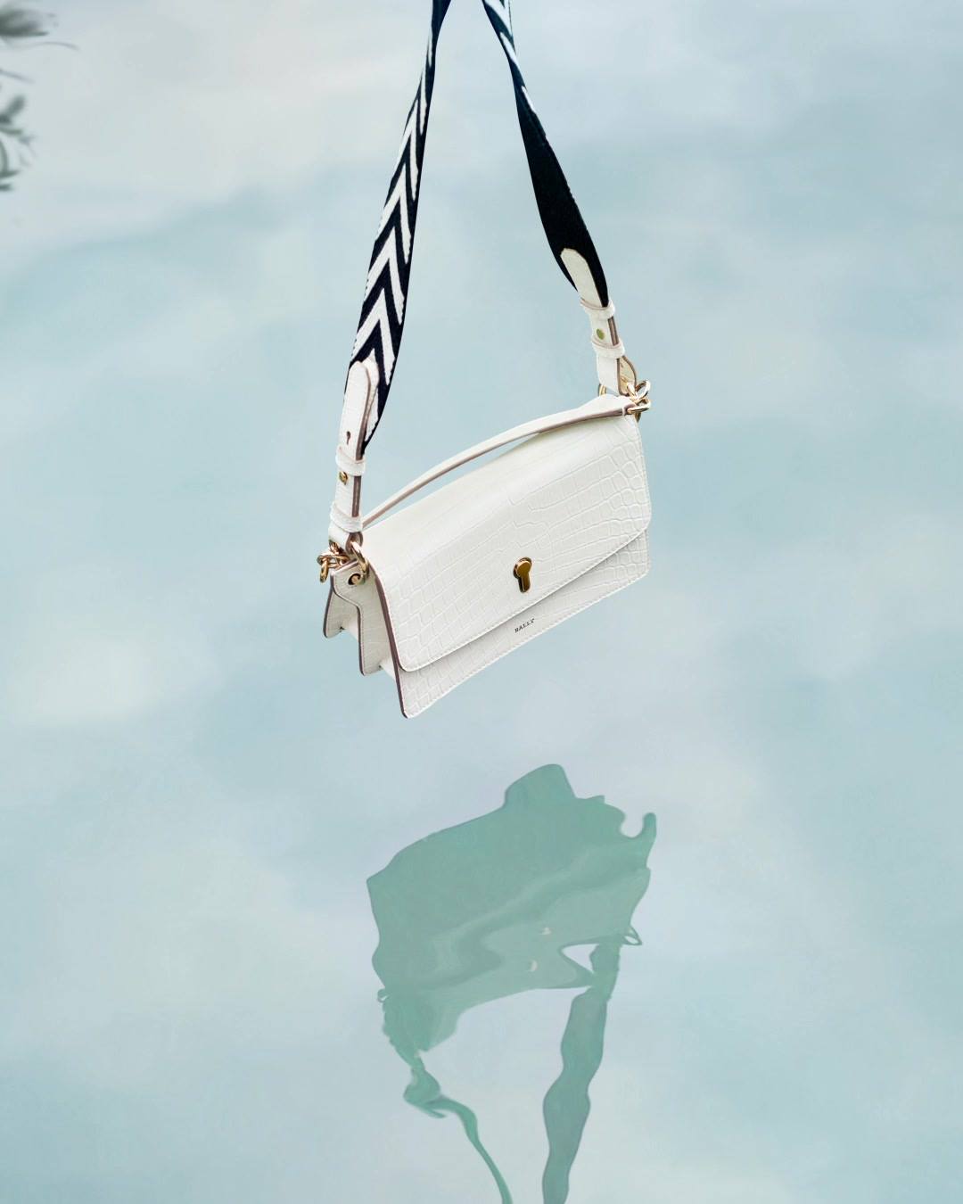 Mirrored reflections. Here, the new #BallyCelestine dangles in white.
