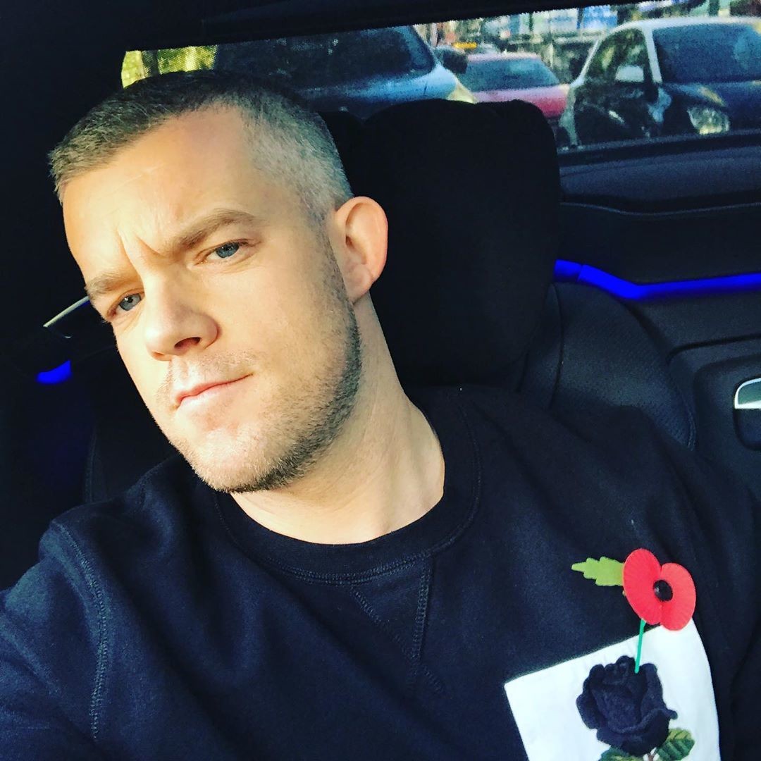 Russell Tovey as seen in our iconic 1926 rose embroidered sweatshirt in navy.