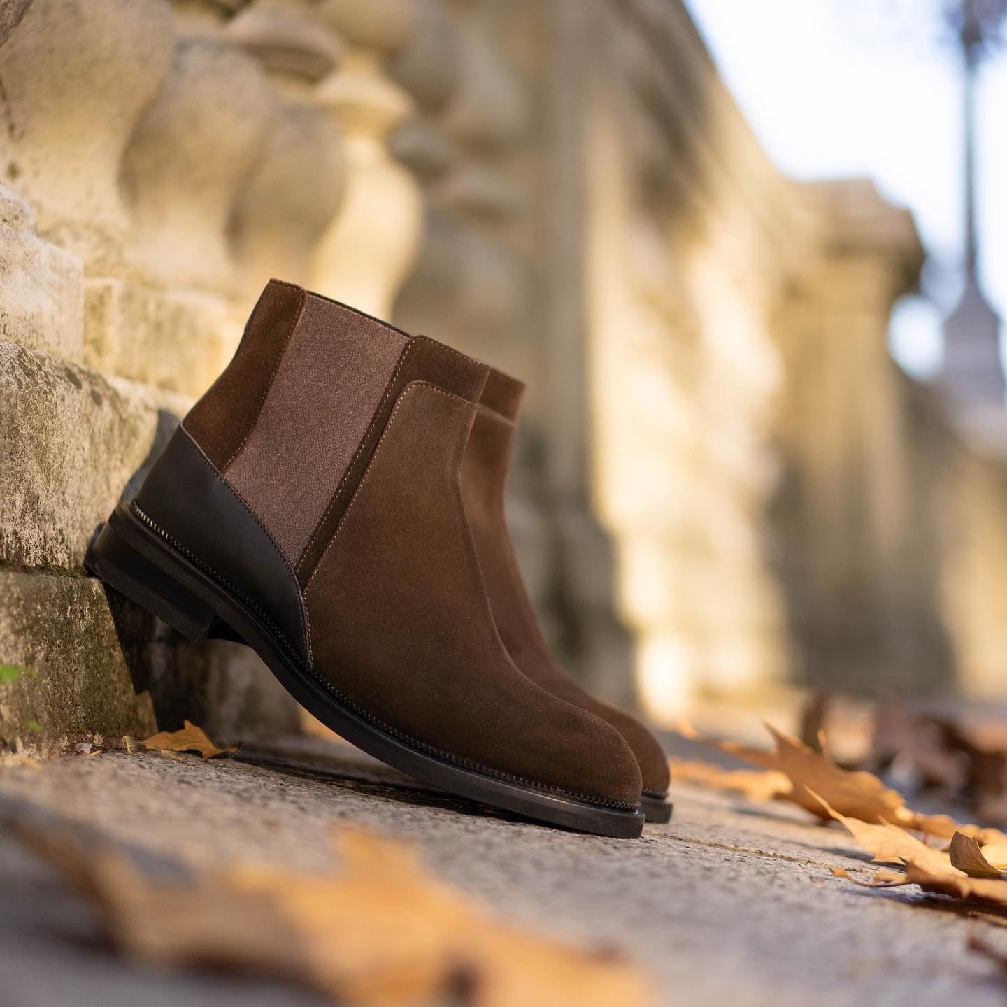Wearing a carefully handcrafted masterpiece to take a walk at a slow pace, in dreamy light and warm color shades. #journeythroughtime #atestoni #fw20 #italiandesign #madeinbolognasince1929 #luxury #luxuryattire #finecraftsmanship #italianshoes #italianshoes