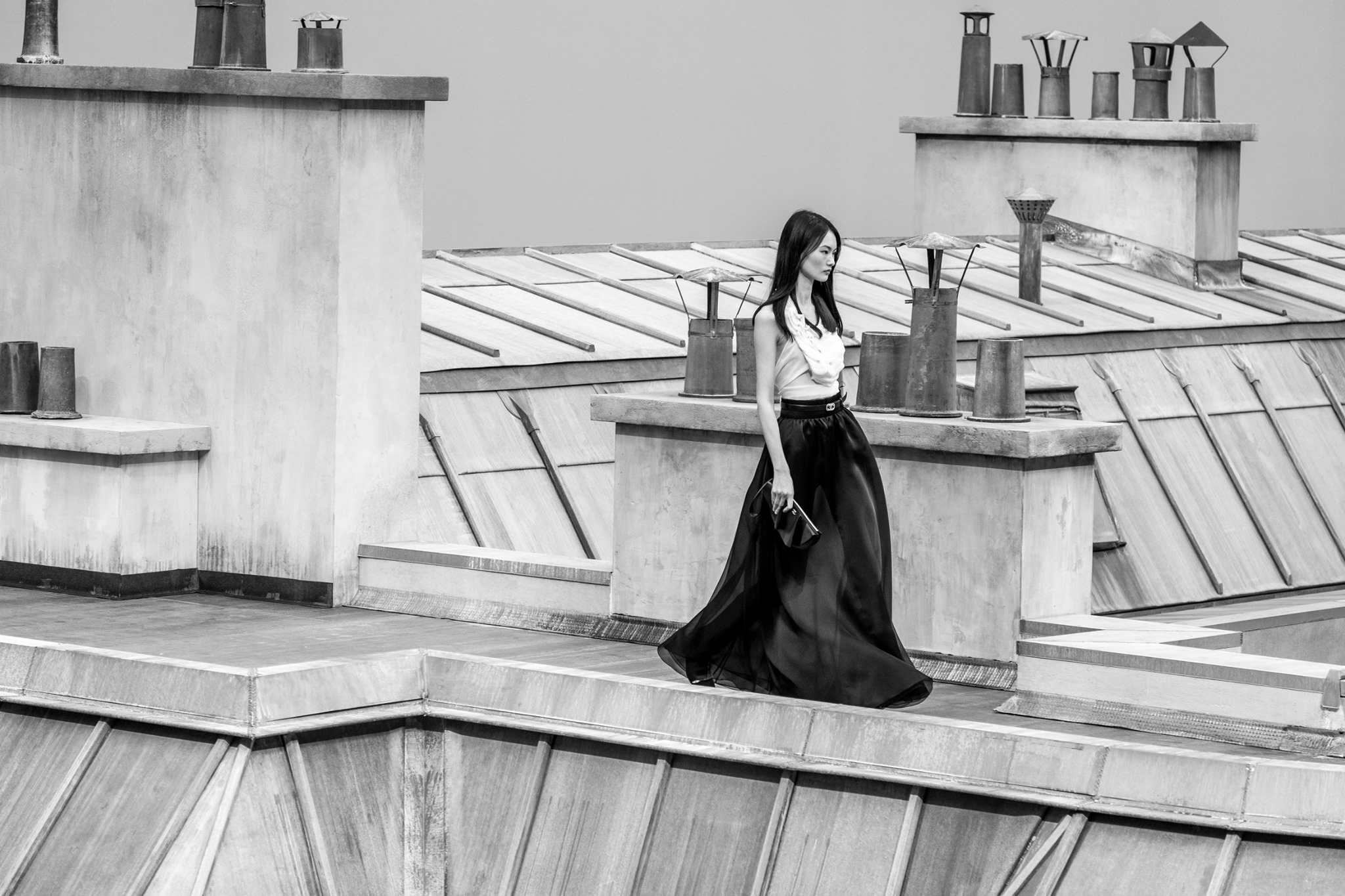 Hindering no movement, fluid organza dresses swept Parisian rooftops recreated under the nave of the Grand Palais at the Spring-Summer 2020 show.