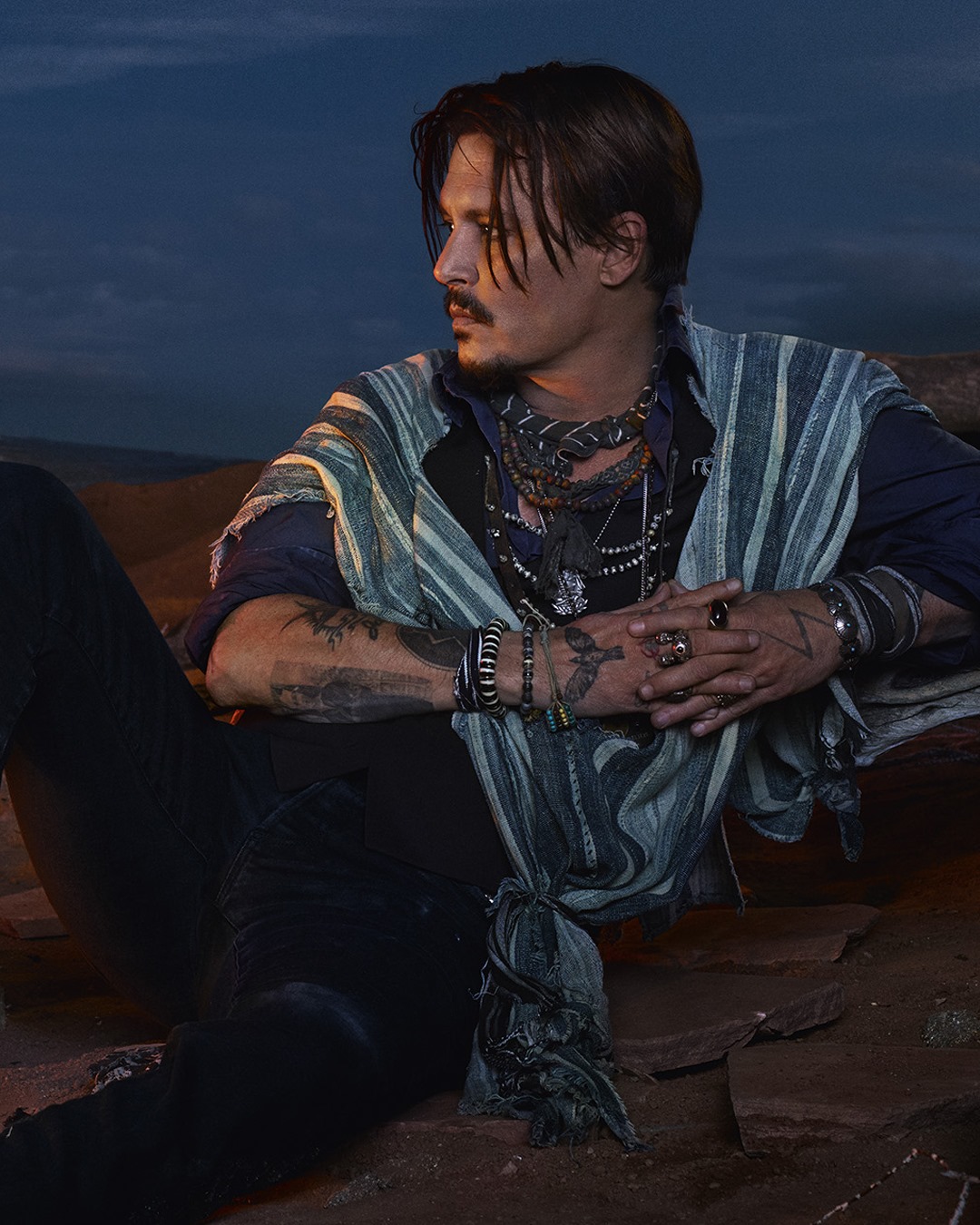 In the deep blue night, alone in this unspoiled expanse, Johnny Depp is at one with nature.