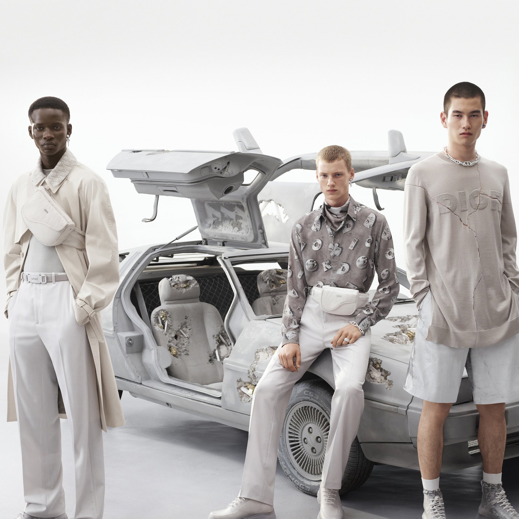 A newspaper print, originally debuting in the Spring-Summer 2000 haute couture show, emerges as a key element of the Dior Summer 2020 men's collaboration between Kim Jones and Daniel Arsham, discoverable on.dior.com/summer20. Against a backdrop of an eroded DeLorean car sculpture by the American artist, that repurposed print appears on pieces ranging from t-shirts and scarves to B23 high-top sneakers.