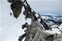 An early season ascent of Mount Stuart turns typically easy terrain into a delicate dance over lingering snow fields. 