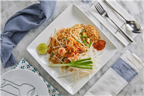 Phad Thai, the fried Thai rice noodles with tamarind sauce and fresh prawns served with crushed peanut and chili powder, is the most common street food in Thailand
