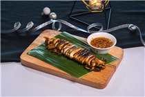 Chargrilled Squid with Spicy Tangy Sauce - this chargrilled giant squid will “WOW” you at first glance. Served with traditional seafood sauce topped with grounded peanuts. Perfect for sharing!  #GreyhoundCafeHK #GreyhoundCafe #Thaifood #泰菜 