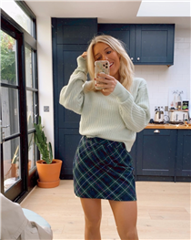 Dressing up to stay home @emshelx keeping it comfy but cute in our Derby Check Skirt 🖤