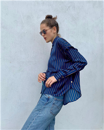 Xaviera Quita layering up the blues for chic tonal look in our striped satin shirt. 