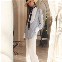 Tuxedo shirt details, transformed into a fluid tunic. The Damien shirt, combining striped seersucker-effect satin with a wingtip collar, piqué bib, and French cuffs, finished with mother-of-pearl cuff links and an embroidered "RL" monogram. Discover more from #RLCollection Spring 2020: