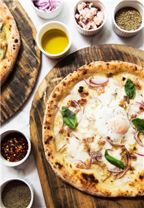 Our Carbonara pizza - an egg-stra moment!