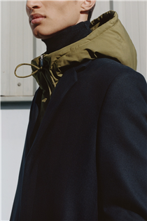 The padded hood: a light layer styled under our classic tailored wool coat.  Shop the edit: festivalwalk