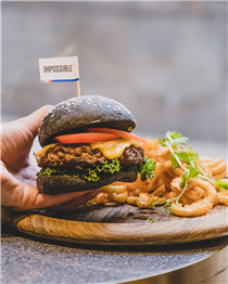 It's IMPOSSIBLE to resist this satisfying 🍔 on a lazy day. Made with @impossible_foods 100% plant-based meat patty with melted cheese, freshly cut tomatoes, lettuce, spiced tomato jam on charcoal brioche and served with crispy curly fries.  Watch out! Your table mate might steal those fries when you're not watching! Kidding. 😉 Come and make new friends at The Coffee Academïcs. We are all working on our 👨‍💻👩‍💻.   Get it at our shops or on @deliveroo_hk now....