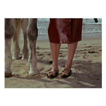 Captured on the beach for the Gucci Spring Summer 2020 campaign Of Course A Horse, leather ballet flats featuring an oversize Horsebit hardware and chain detail. Discover more on.gucci.com/2020_.