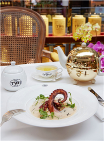 Indulge in TWG Tea seared Spanish octopus served with a langoustine emulsion sprinkled with African Ball Tea leaves, accompanied by a pearl couscous ragout with diced wagyu chorizo and king oyster mushrooms at any TWG Tea Salons in Singapore. 