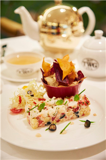 Chilled Boston lobster accompanied by pineapple and berries tossed in a mentaiko spicy cod roe dresssing, served with vegetable chips sprinkled with Magic Moment Tea and frisée salad.