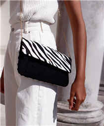 Drop into your local #Accessorize store on the way home from work and celebrate #NationalHandbagDay with 20% off ALL handbags (online too!) We're obsessed with this zebra print foldover clutch - was just £10, NOW  £8. 📷: @y.a.t.r.i