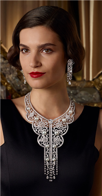 The Sarafane necklace and earrings are inspired by the Russian needlework that Gabrielle Chanel incorporated into her collections. This embroidery-inspired, camellia motif crafted from diamonds and pearls, centers around a stunning, round-cut 10.18-carat diamond, colorless and internally flawless. Discover the collection on chanel.com/-Themaison. 
