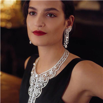 The camellia motif, crafted from diamonds and pearls, centers around a round-cut 10.18-carat diamond on the necklace. This embroidery-inspired necklace and earrings are influenced by the Russian needlework that Gabrielle Chanel incorporated into her collections during the 1920s. Discover the collection on chanel.com/-themaison. 