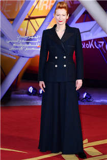 CHANEL in Cinema — House ambassador Tilda Swinton, jury president of the 18th Marrakech Film Festival, in a black and navy tweed suit from the Fall-Winter 2019/20 Haute Couture collection. 